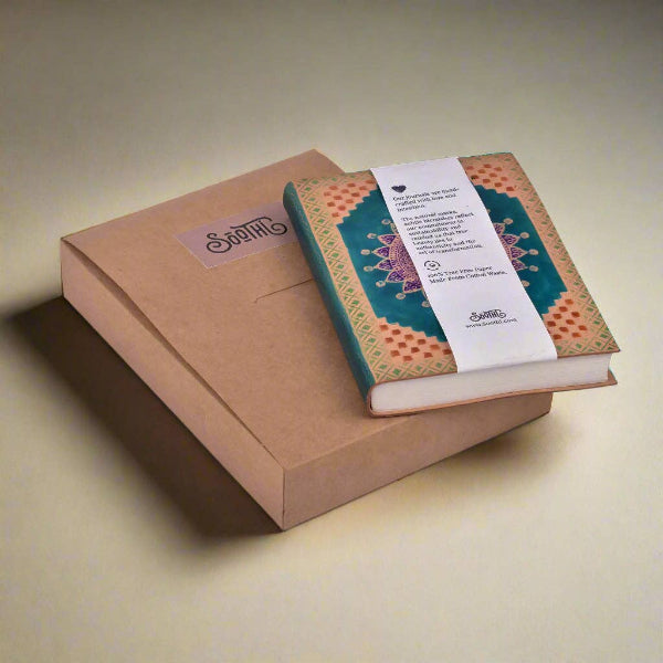 Decorative notebook with a label on a brown box against a beige background