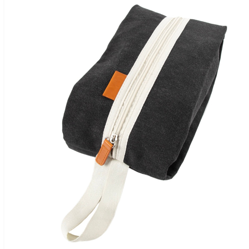 Black pouch with white zipper and strap on a white background
