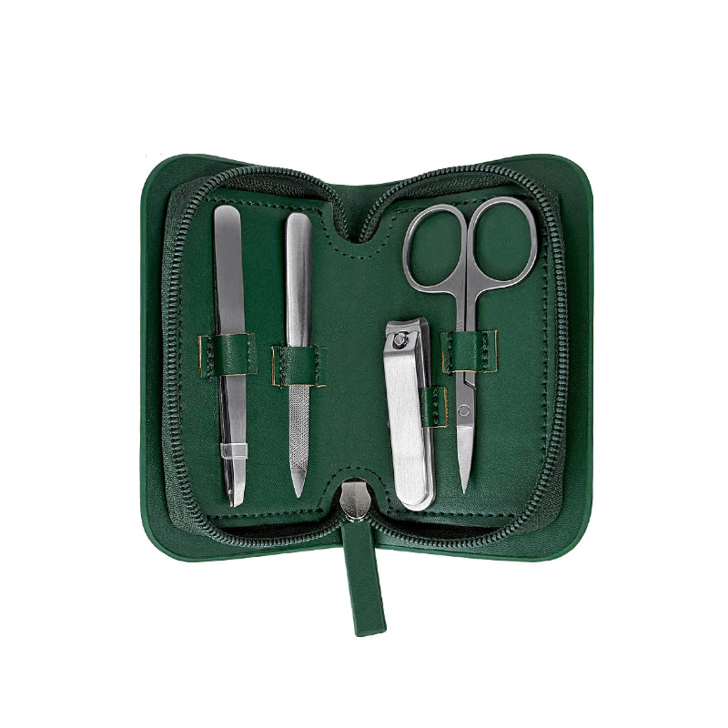 Manicure set with scissors, nail clippers, and files in a green case on a white background